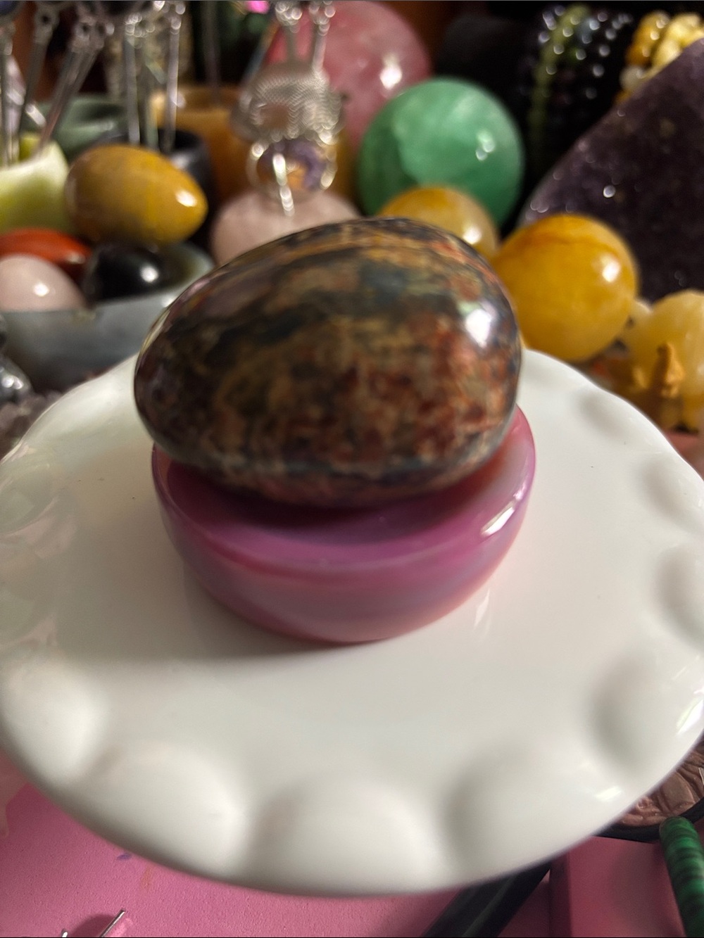 Polished Multicolor Jasper Palm Stone on Pink Display